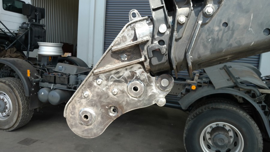 Fabricated crane attachment fitted onto boom