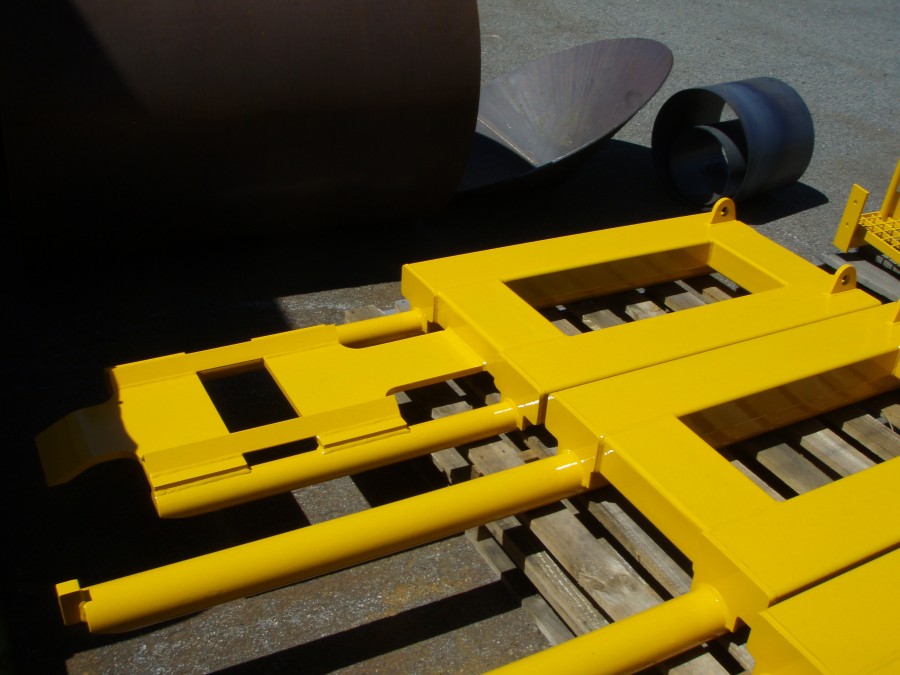 Maintenance forklift attachments to remove track wheels